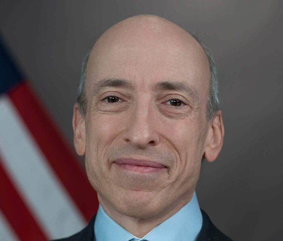 SEC Chair Gary Gensler smiles in a photo.