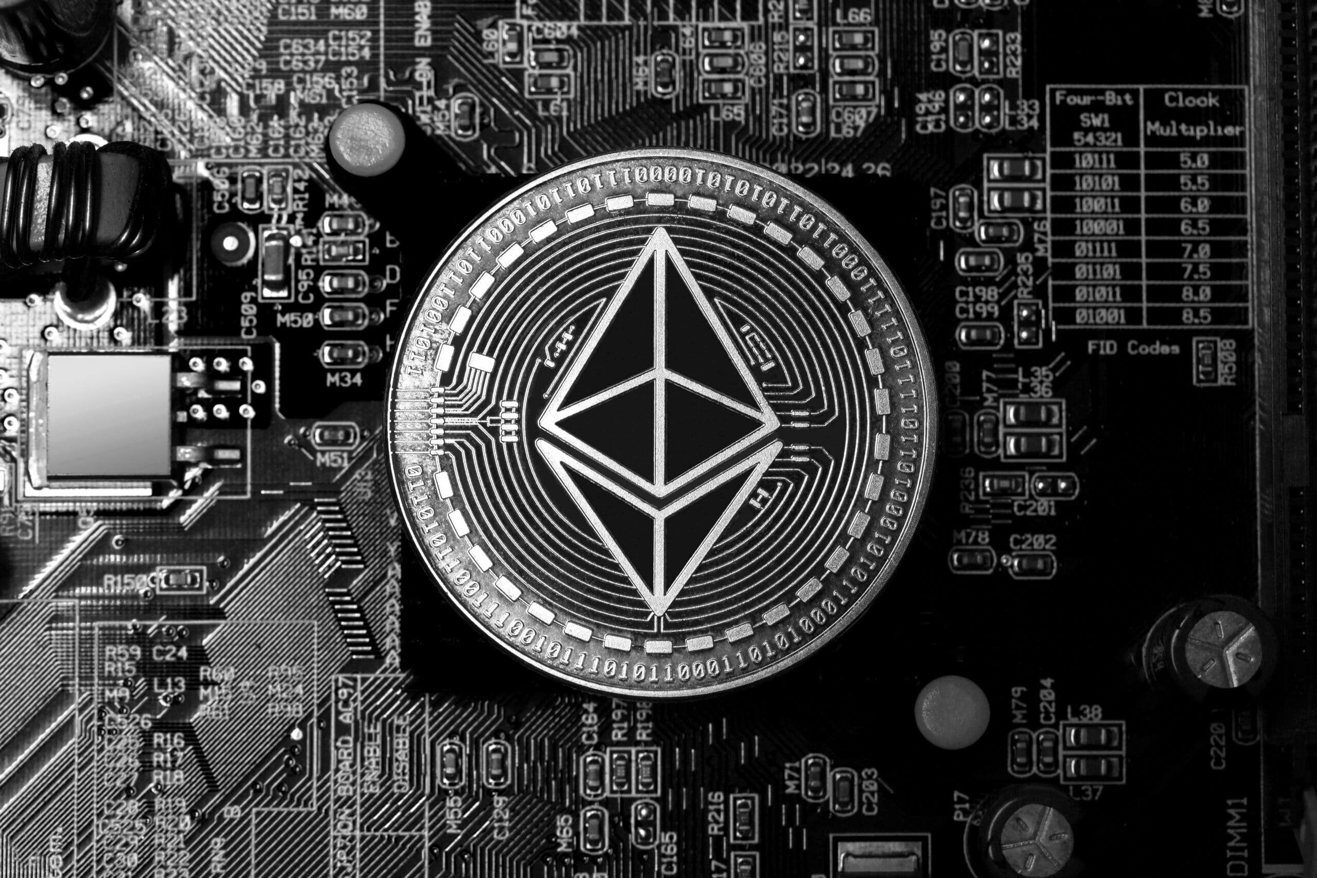 ethereum coin on an computer motherboard black and white