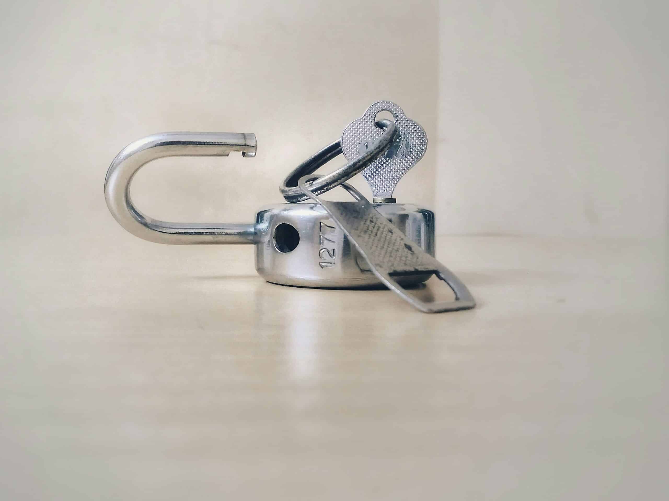 A metal silver lock getting unlocked