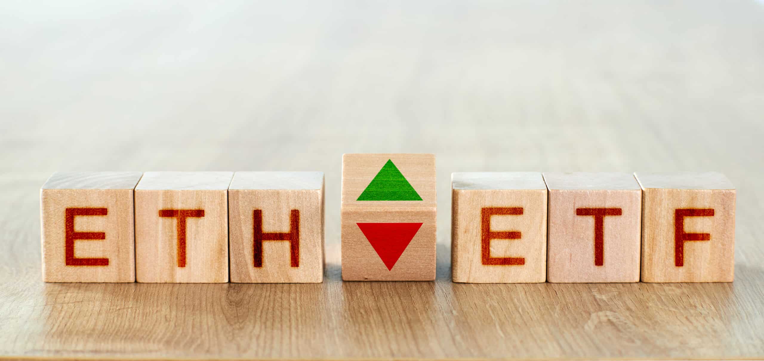 wood blocks with the inscription eth and etf, to boot to arrows symbolizing the upward thrust and tumble of the cryptocurrency (Shutterstock)