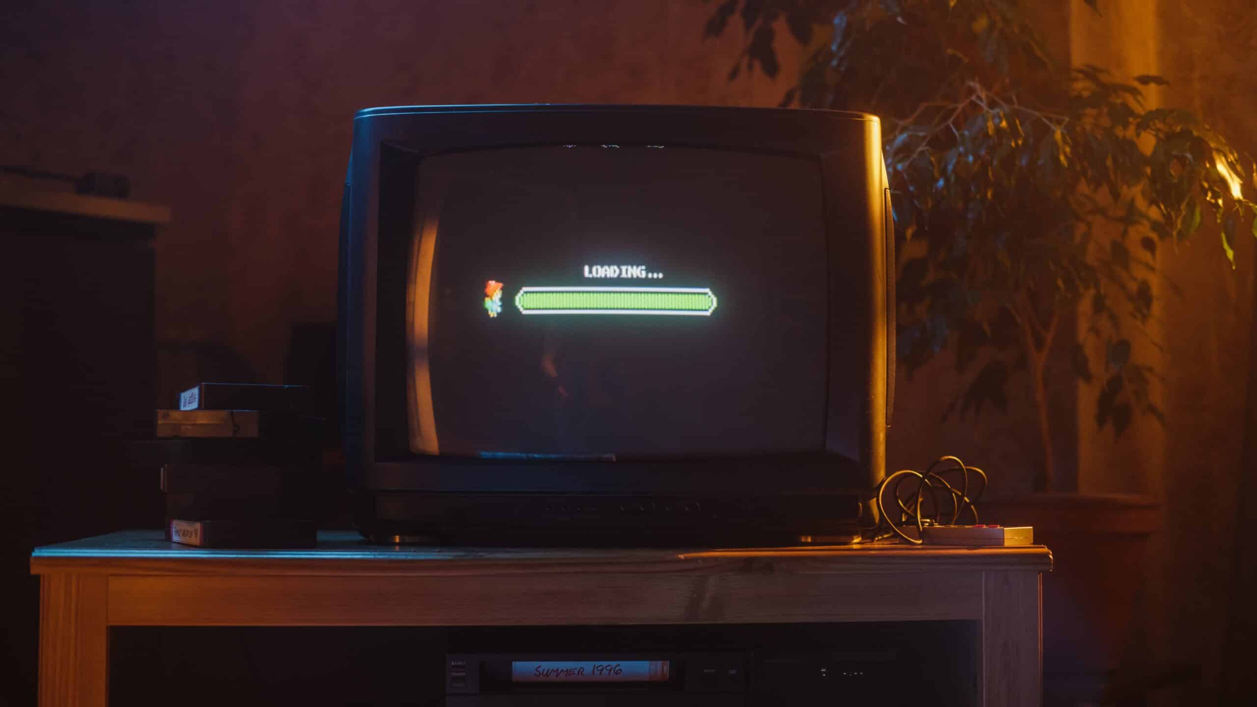 Close Up Footage of a Retro TV Set Screen with an Eight Bit Eighties Inspired Console Arcade Video Game (Shutterstock)